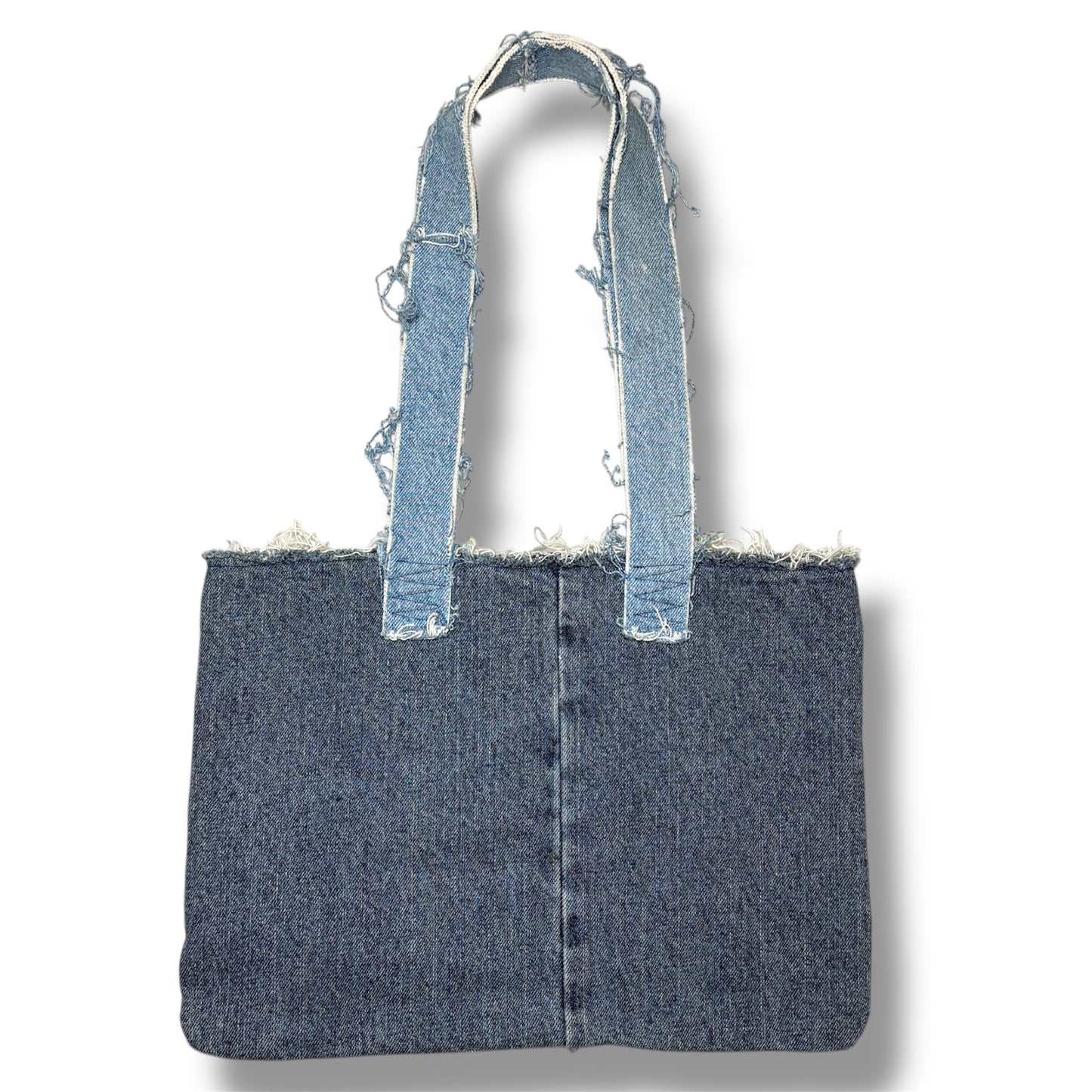 Back side of the Denim Red Handbag featuring clean, light blue denim with frayed strap edges and center seam.
