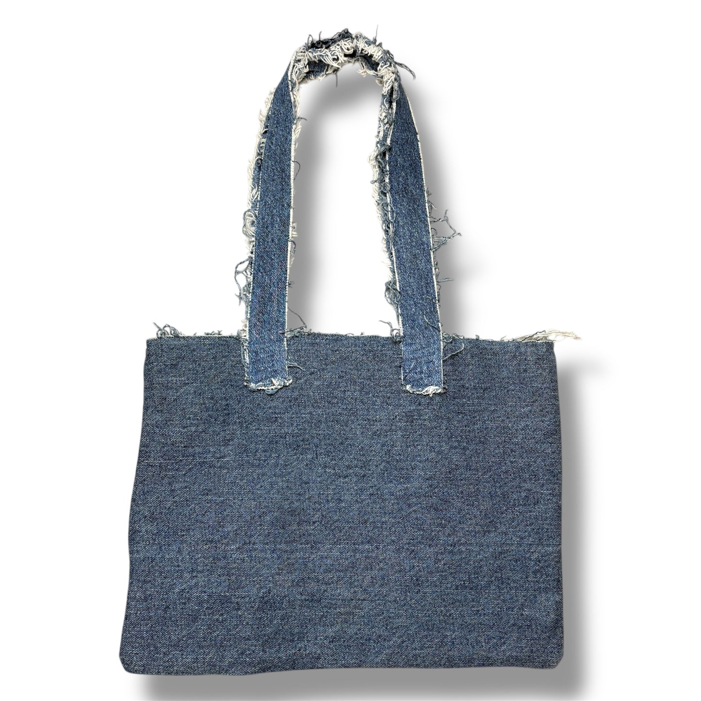 Back view of the Denim Orange Handbag in dark wash denim with frayed strap edges.