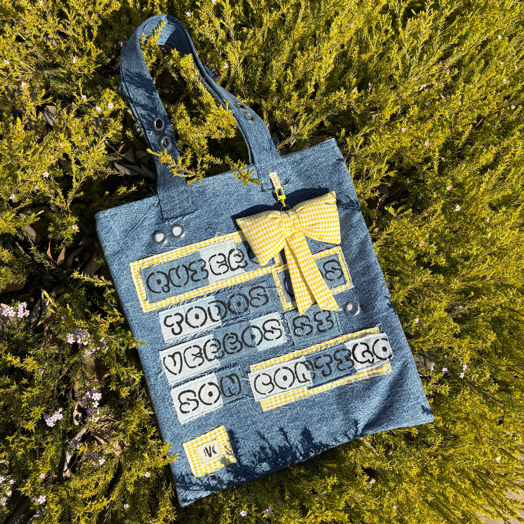 IVENUSA Design logo with bold black bubble letters and yellow graffiti-style paint strokes, featuring sparkle accents – urban branding for a handmade fashion accessories label.