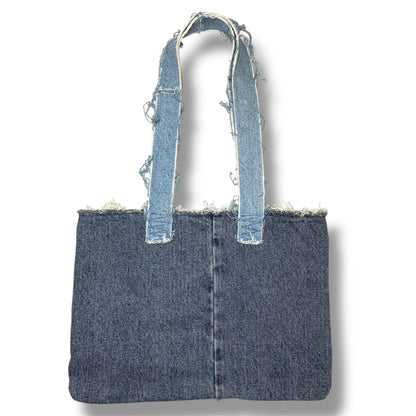 Back side of the Denim Red Handbag featuring clean, light blue denim with frayed strap edges and center seam.