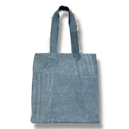 Back side of Iconic Green tote bag made from light and dark recycled denim pieces with clean patchwork lines.