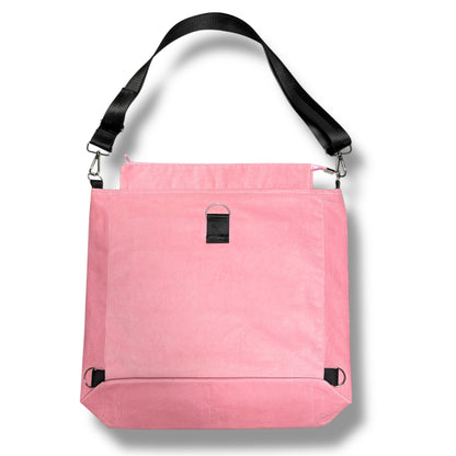 Back of IVENUSA Rosé Avenue Bag in pink corduroy featuring black adjustable strap and reinforced D-ring hardware.