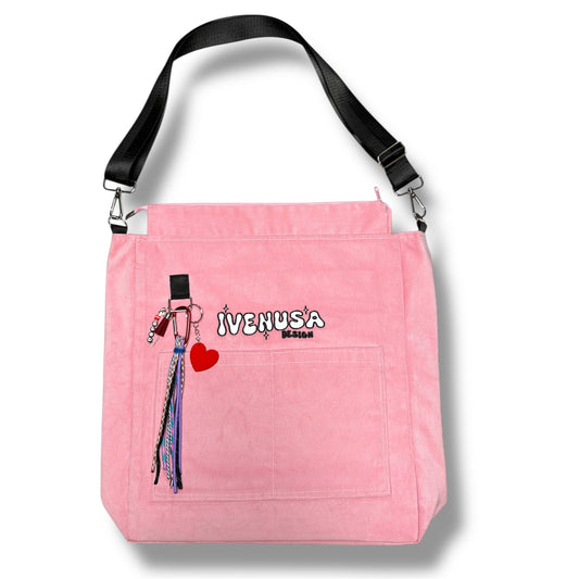IVENUSA Rosé Avenue Bag in pink corduroy with embroidered logo, front pocket, and detachable multicolor keychain accessories.