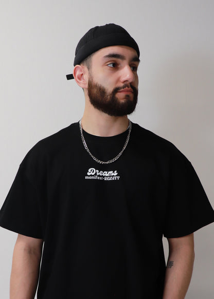 Minimal front view of black DMR oversized boxy t-shirt