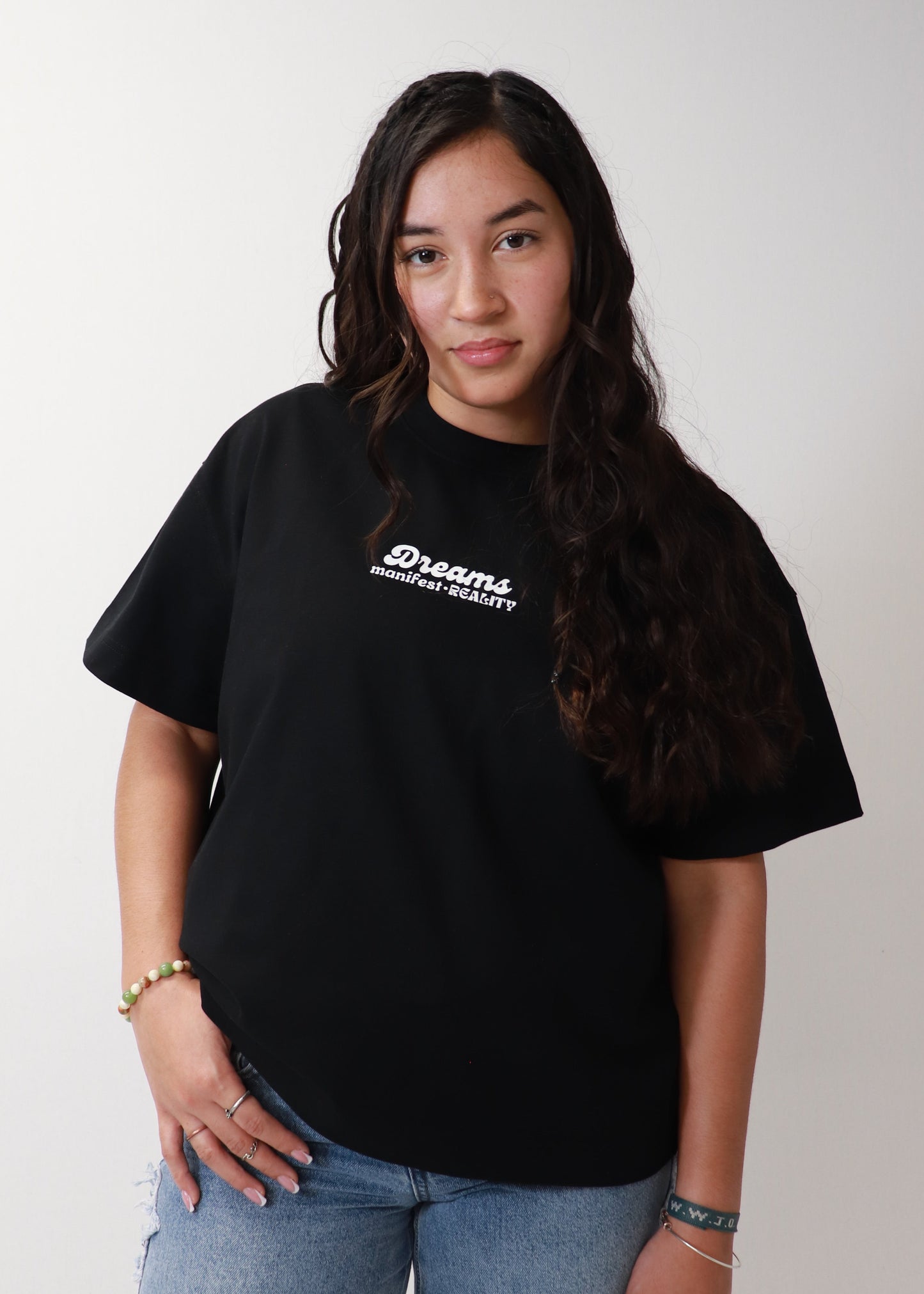 Black oversized boxy DMR t-shirt front view worn by female model