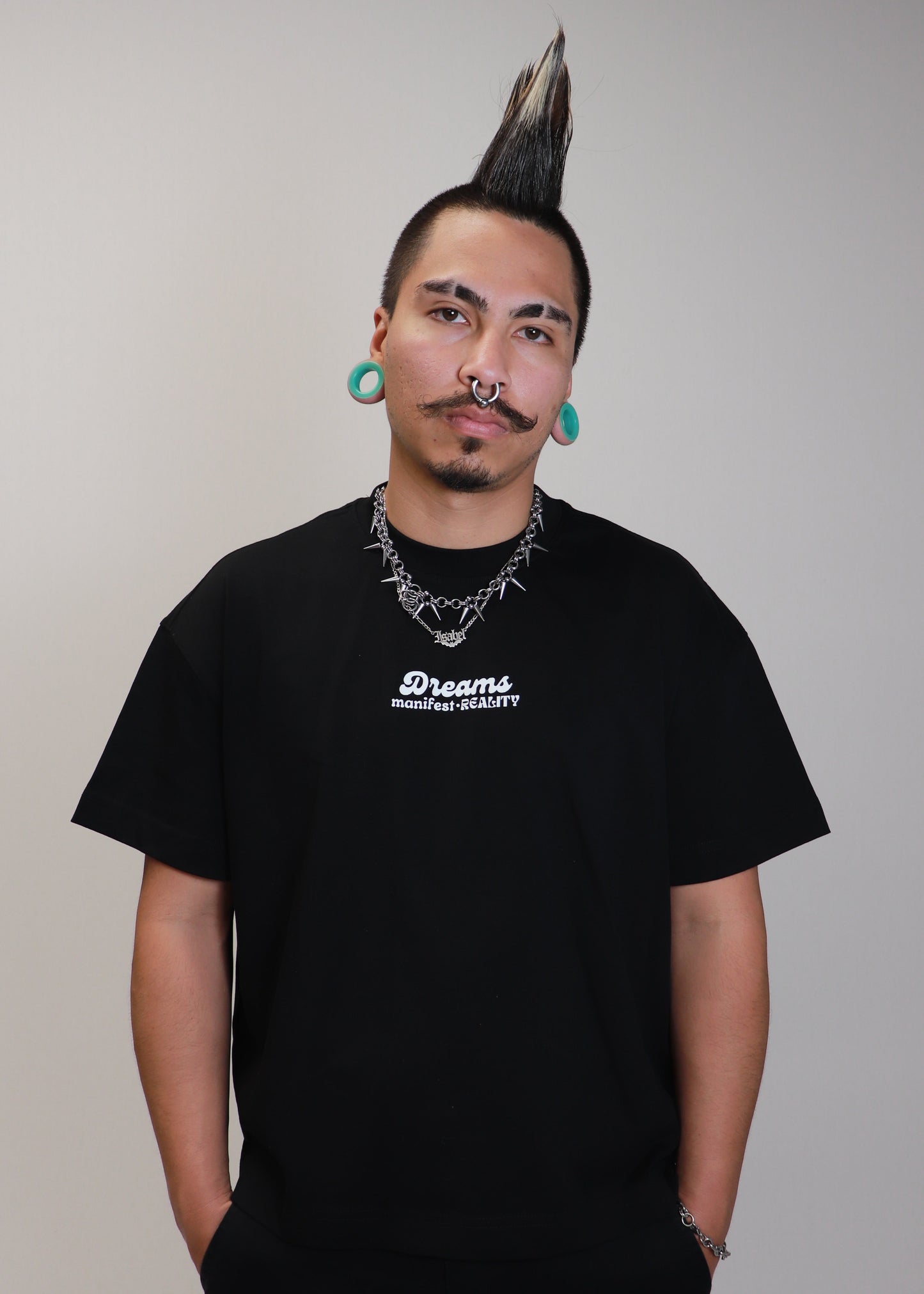 Male model wearing black DMR oversized boxy t-shirt front view