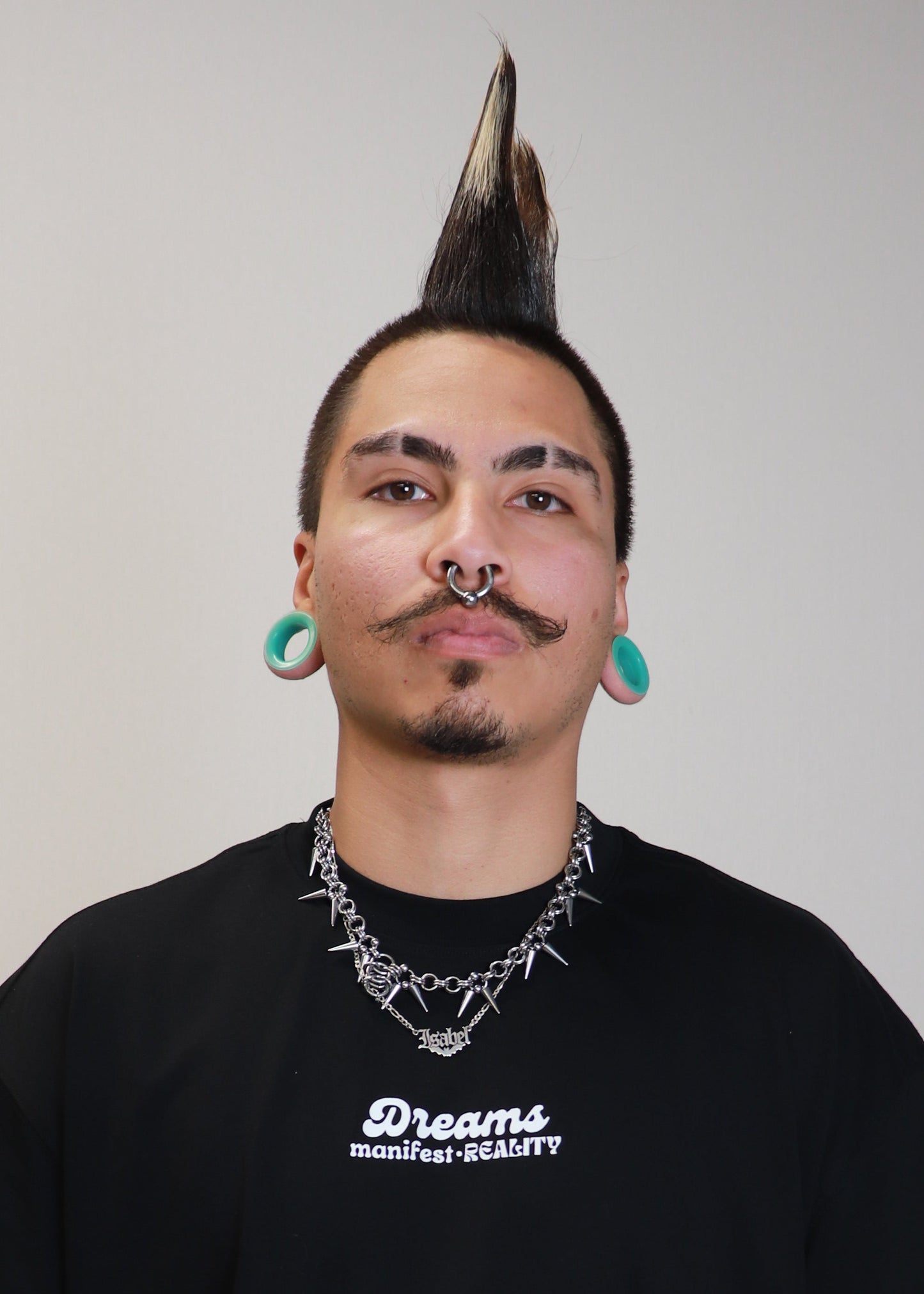 Portrait of male model wearing black DMR oversized t-shirt