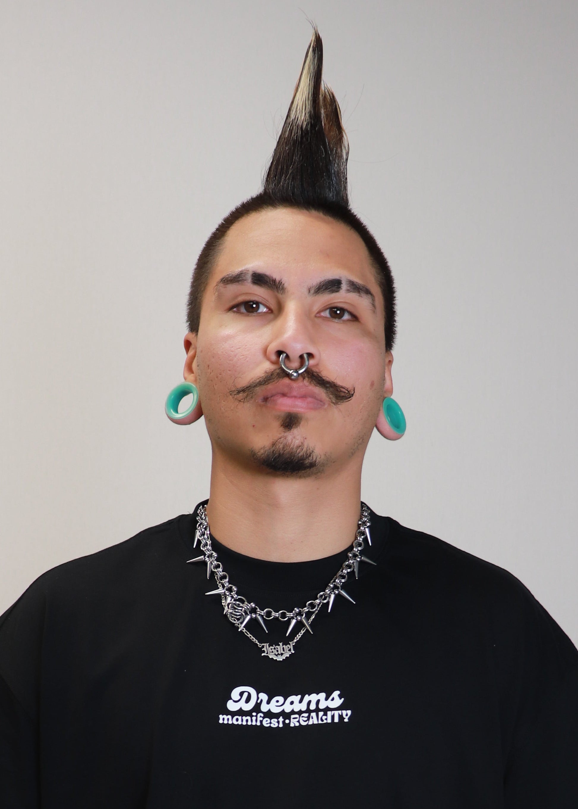 Portrait of male model wearing black DMR oversized t-shirt