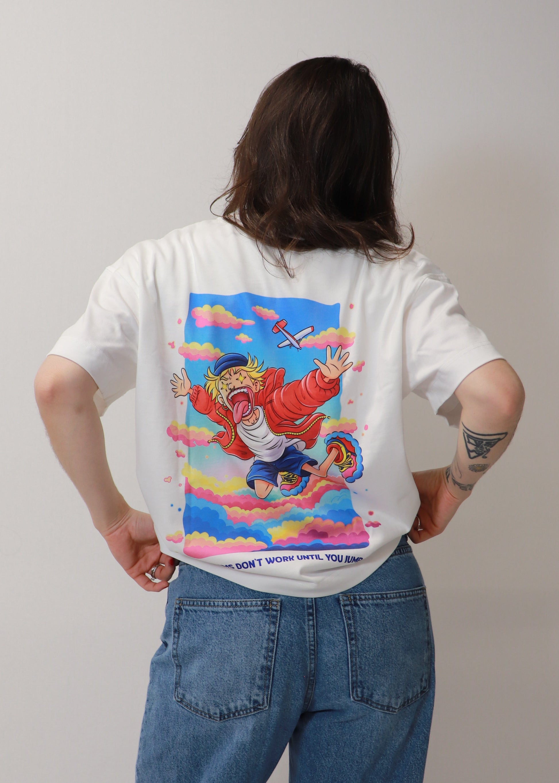 Back view of white DMR oversized t-shirt with colorful graphic design