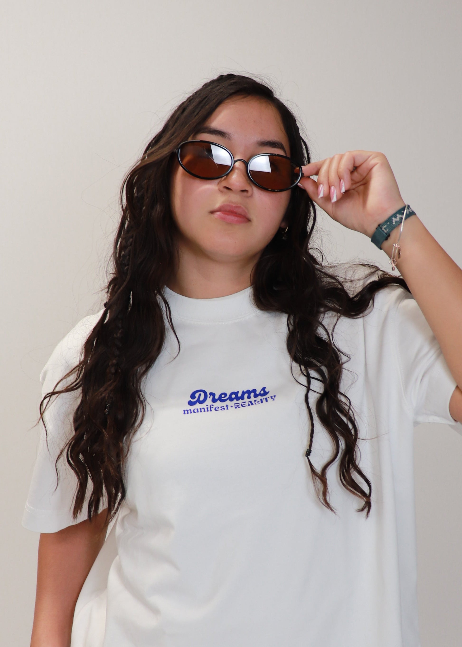 White DMR oversized t-shirt worn casually by female model