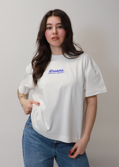 White oversized boxy DMR t-shirt front view worn by female model