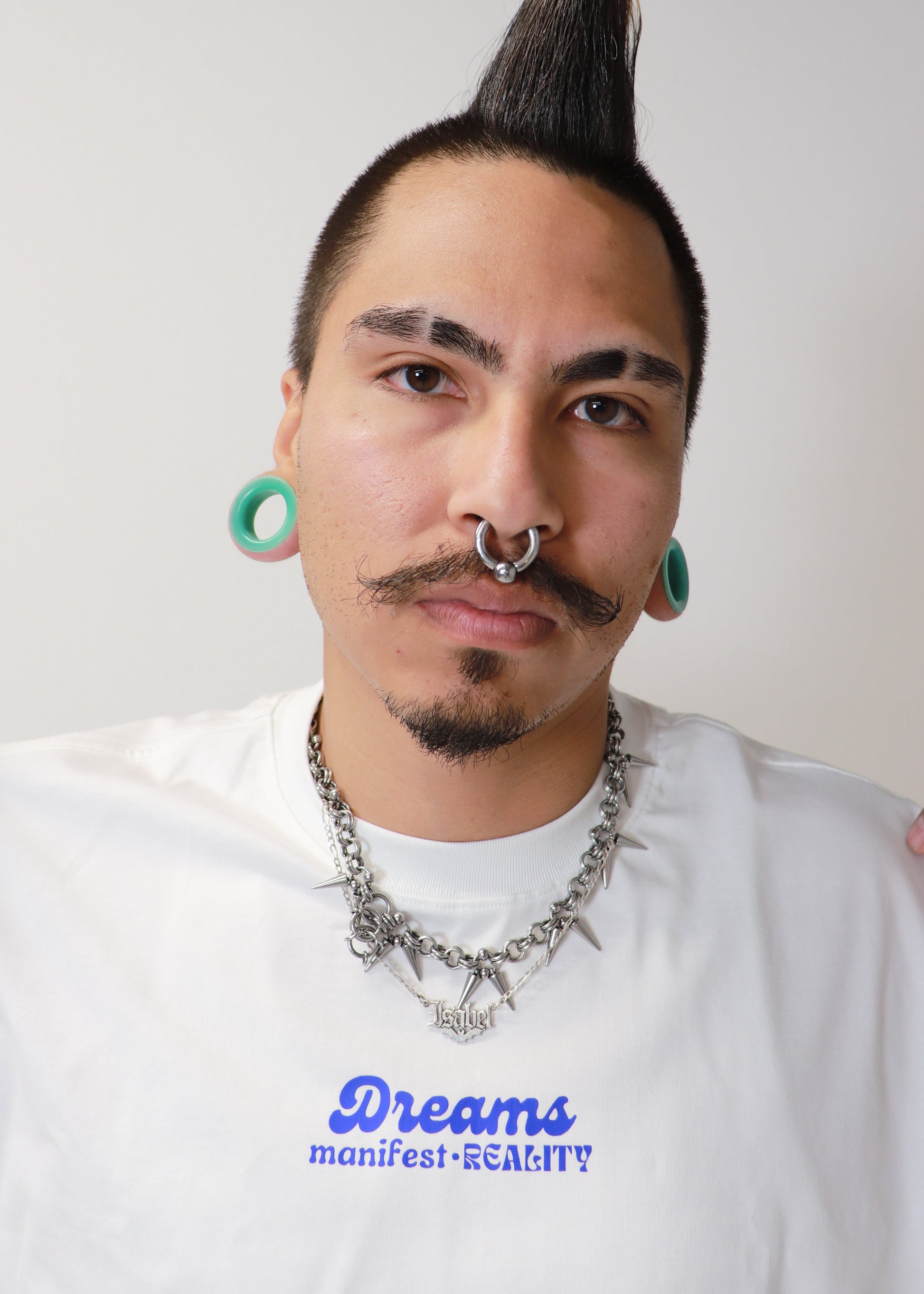Male model wearing white DMR oversized boxy t-shirt front view