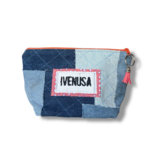 Patchwork denim makeup bag with quilted texture, orange zipper, and IVENUSA fabric logo tag