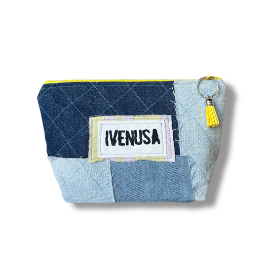 Patchwork denim makeup bag with quilted texture, yellow zipper, and IVENUSA fabric logo tag