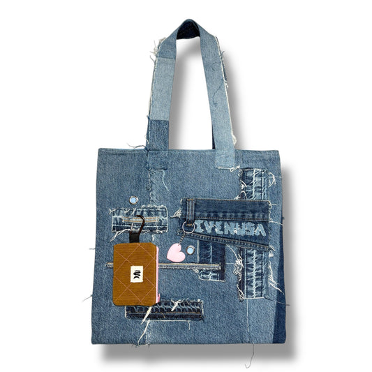 Handmade denim tote bag featuring boho-style patches and brown wallet